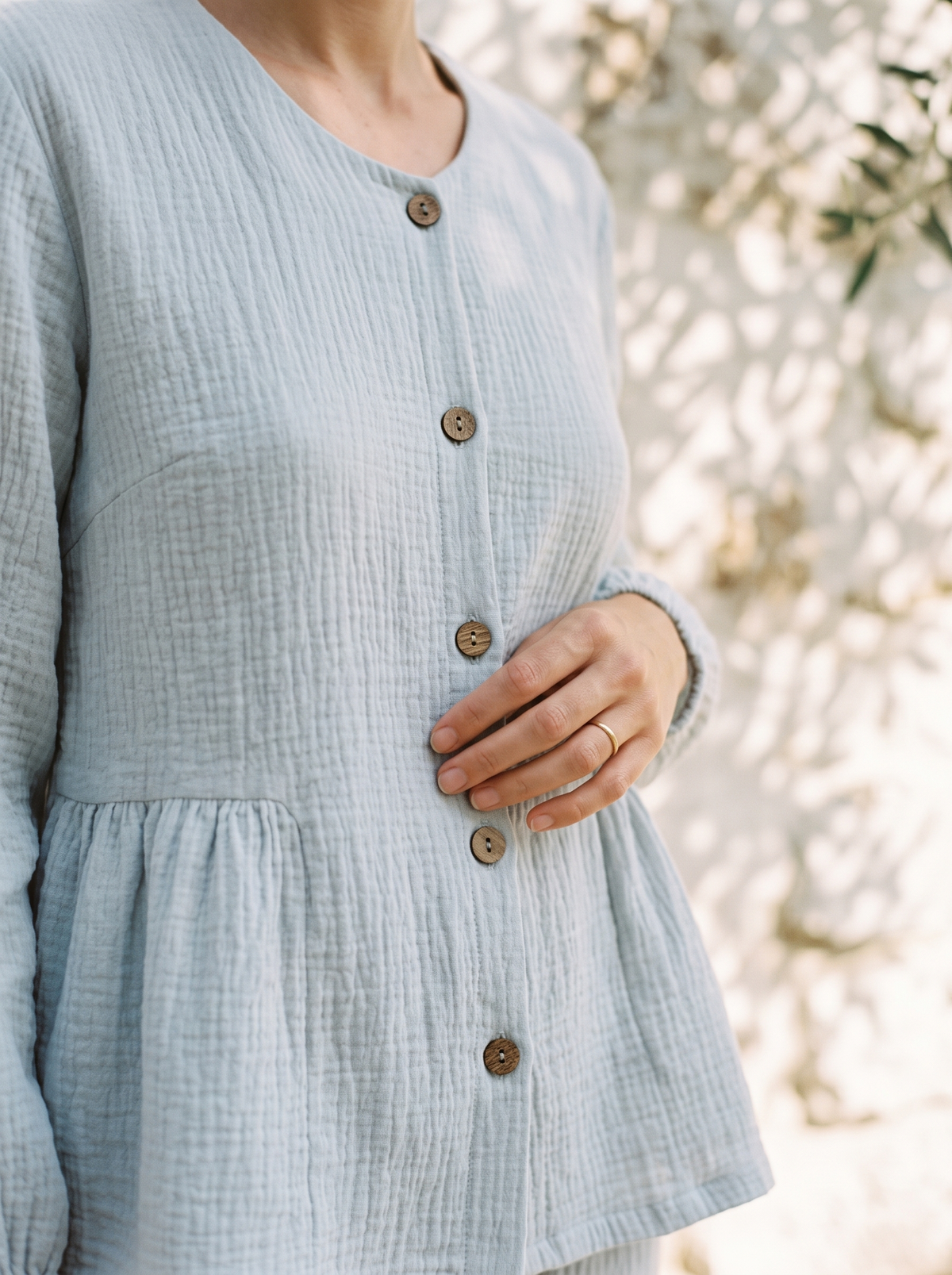 Detail of the peplum top and wooden buttons on The Finca Set