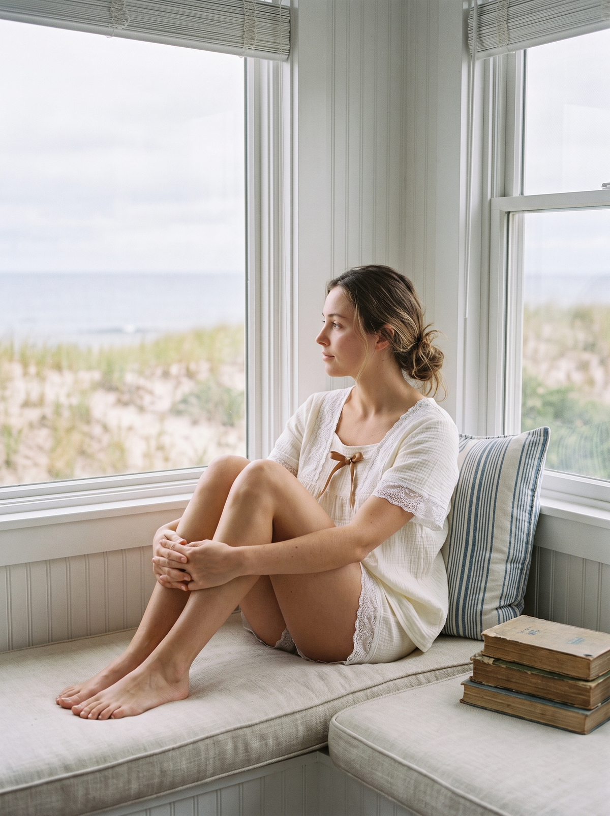 The Cottage Set in White on a window seat overlooking the dunes